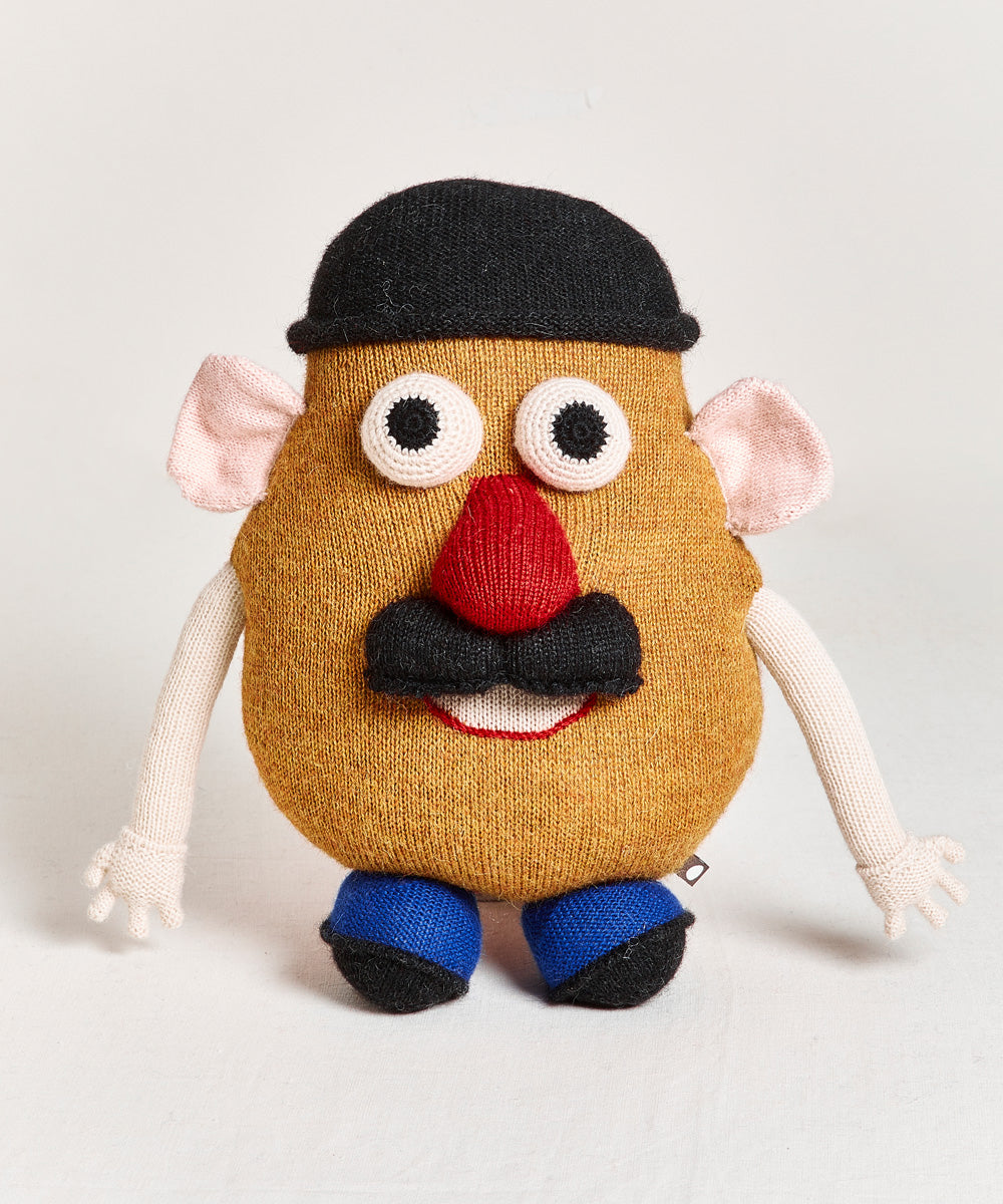 Plush Funny Face Pillow shaped like a potato with a black hat, googly eyes, red nose, mustache, and blue shoes.